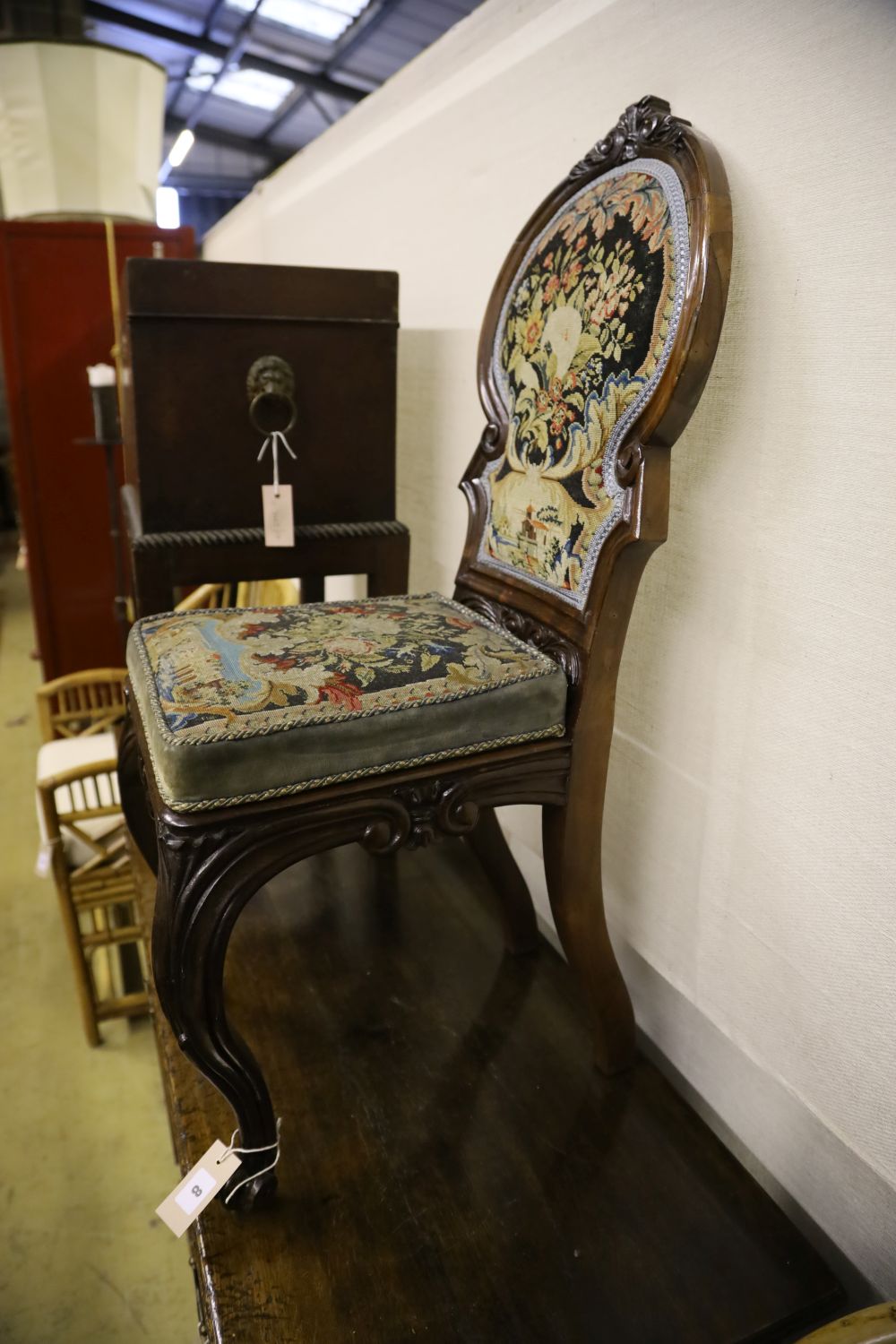 A Victorian mahogany hall seat with tapestry upholstery